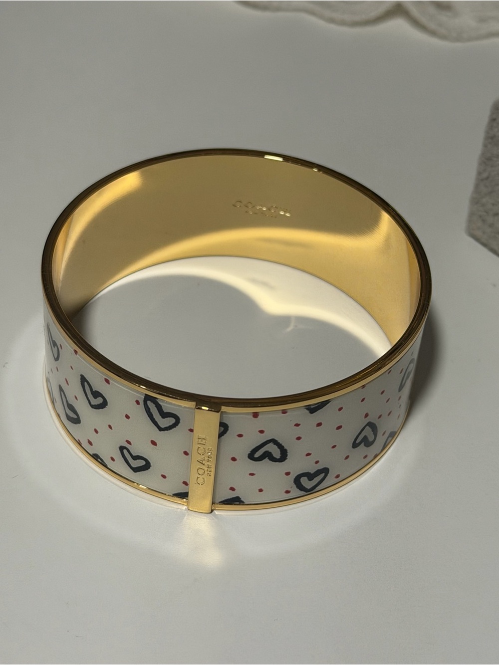 Coach White Enamel Bangle with Navy Heart Motif and Gold Trim